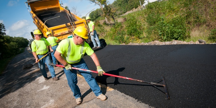 10409061265_33a2ed42d4_k.jpg MoDOT worker pouring asphalt