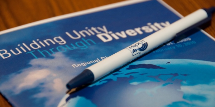 unity through diversity Image of a unity through diversity handbook and pen