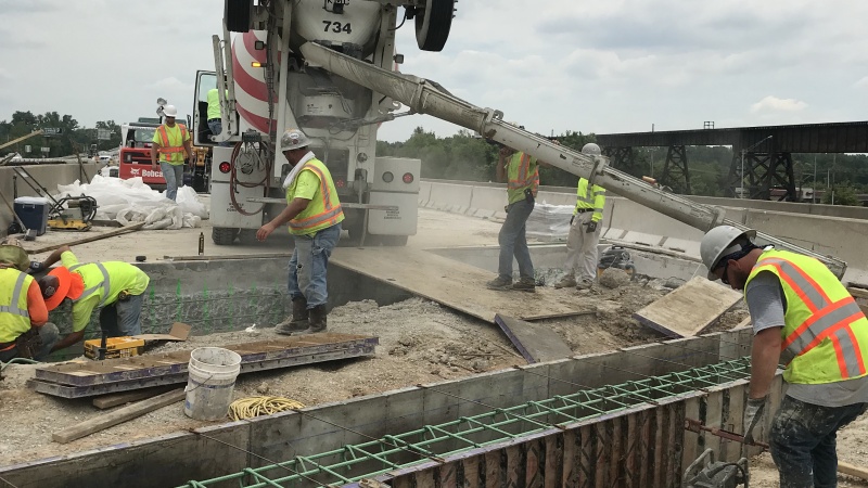 Crews placing concrete