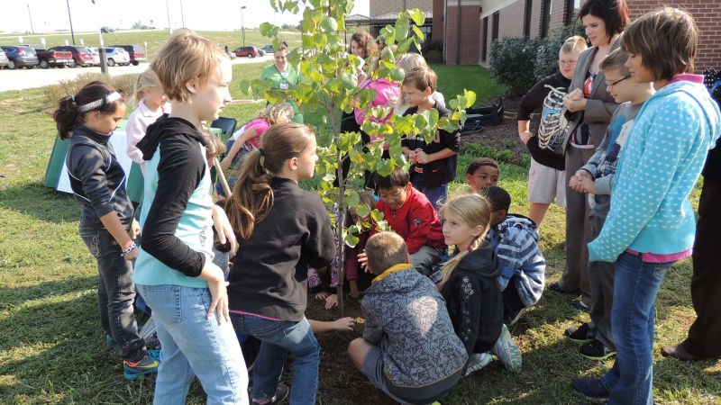 MoDOT crews discuss trees with a group of children